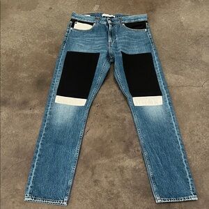 Calvin Klein Men's Blue Denim Jeans with Black & White Patch Accents